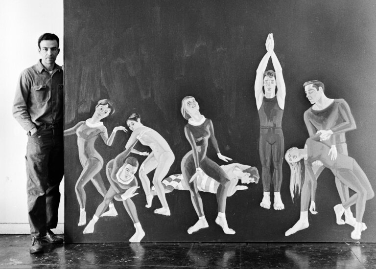 Alex Katz in his studio with a painting of the Paul Taylor Dance Company