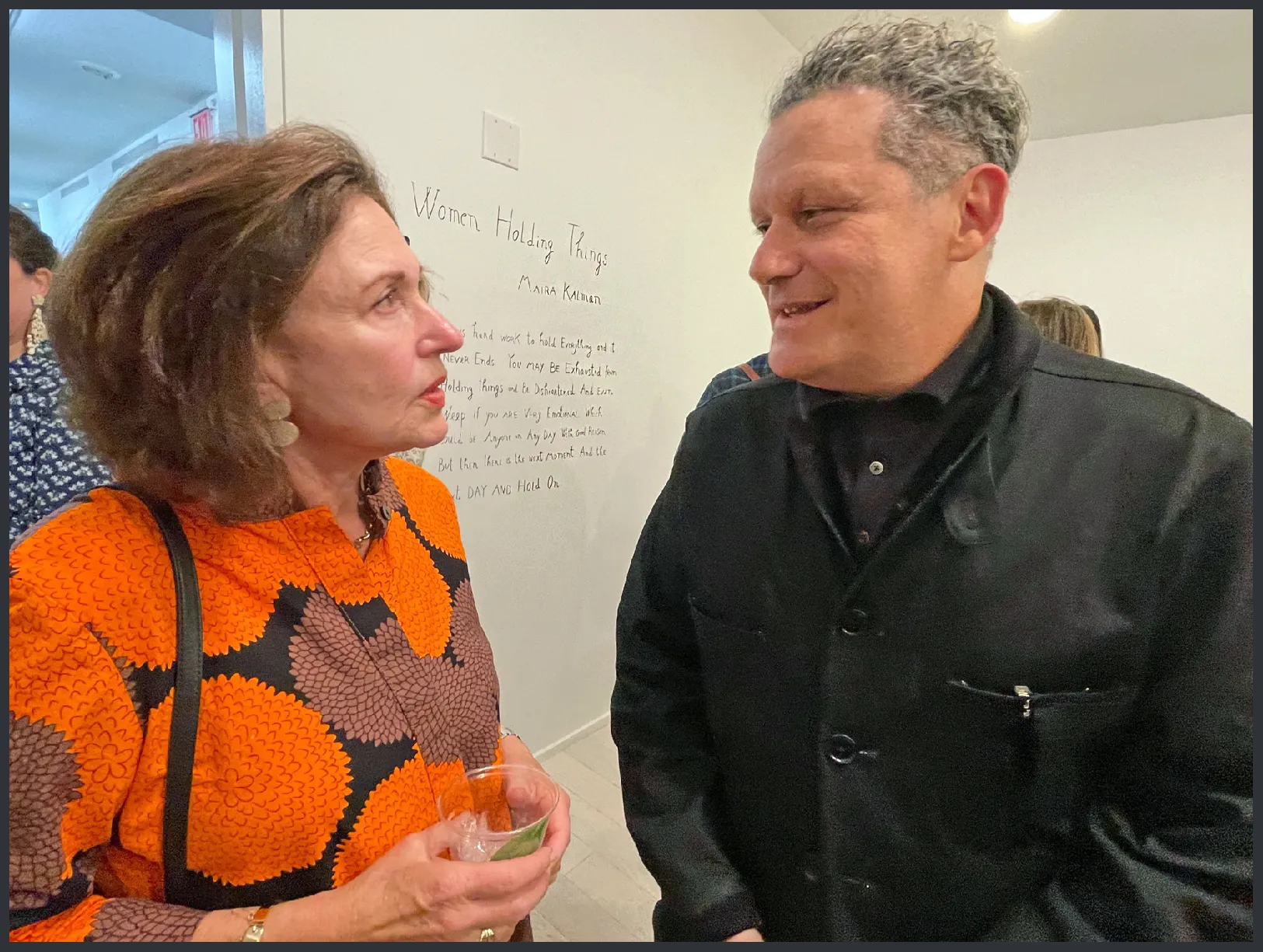 Community and cultural activist Linda Saul-Sena greets fashion designer Isaac Mizrahi, for whom Kalman designed whimsical fabrics.